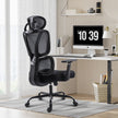 Black GGCIR ergonomic office chair placed in a modern workspace, featuring a high backrest and adjustable headrest for productivity.